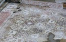 St Cosmos + Damian Floor * the Church of St. Cosmos and St. Damian, twin brother doctors who were martyred in the 4th century, has the most splendid floor mosaics to be seen in Jerash. An inscription dates the mosaic to 553 AD, and the images include the churchwarden Theodore with his wife Georgia, praying with widespread arms. * 432 x 276 * (86KB)